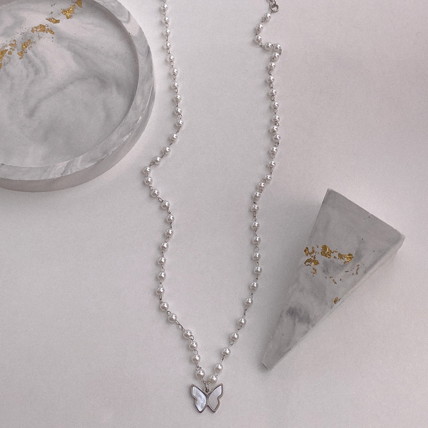Butterfly pearl necklace
